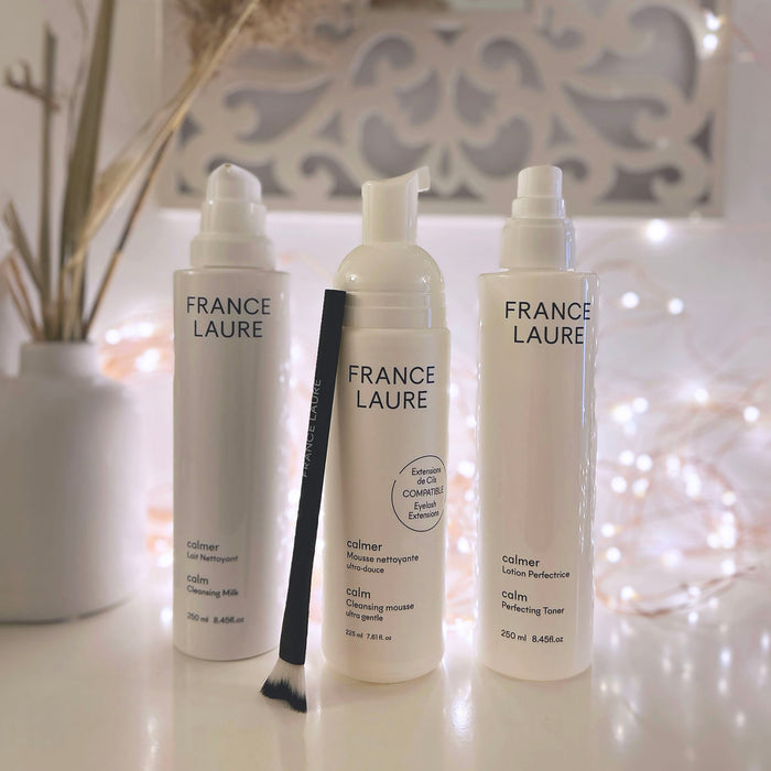 France Laure Calmer skincare trio: cleansing milk, ultra-gentle mousse, perfecting toner with applicator brush, ideal for sensitive skin routines.