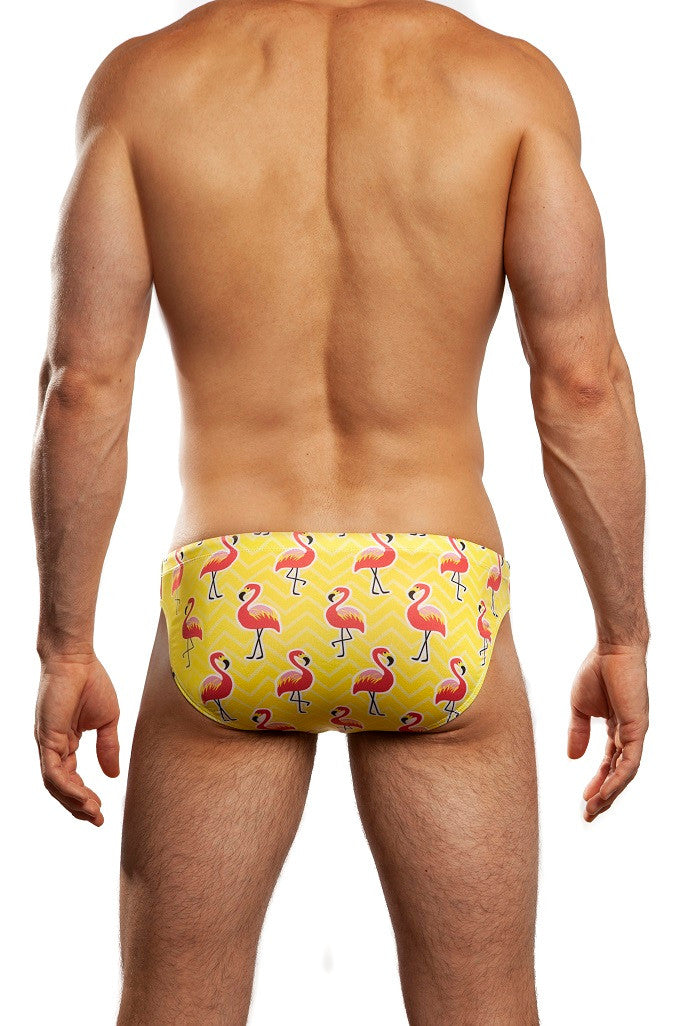 Man standing wearing a pair of Jack Adams yellow Flamingo Swim Brief (back view) on a white background.