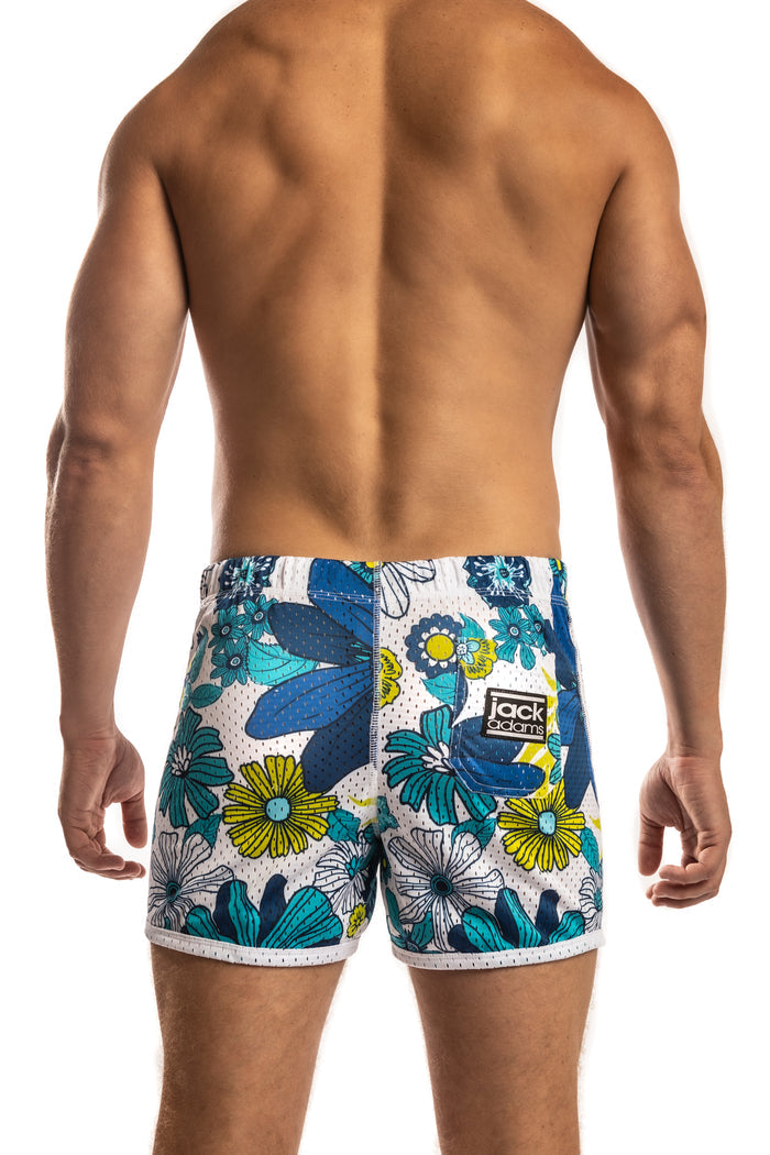 Man wearing a pair of flower power - blue Jack Adams Freestyle Mesh Shorts (back view) on a white background.