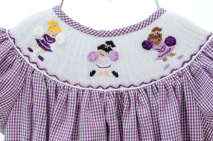 Smocked purple and white cheerleader dress and bubble to cheer