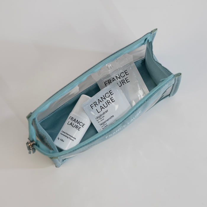 France Laure travel skincare set with Harmonizing Cream and Regenerate Gel Mask in a light blue zippered pouch