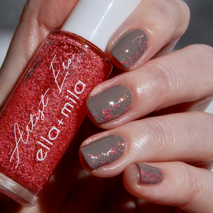 Rose Burst pink glitter liner accents on a sheer nude manicure, holding the bottle