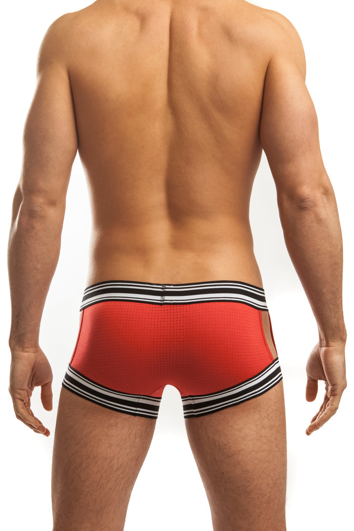 Man wearing a pair of red jack Adams Sport Tek Trunk (back view) standing in front of a white background.