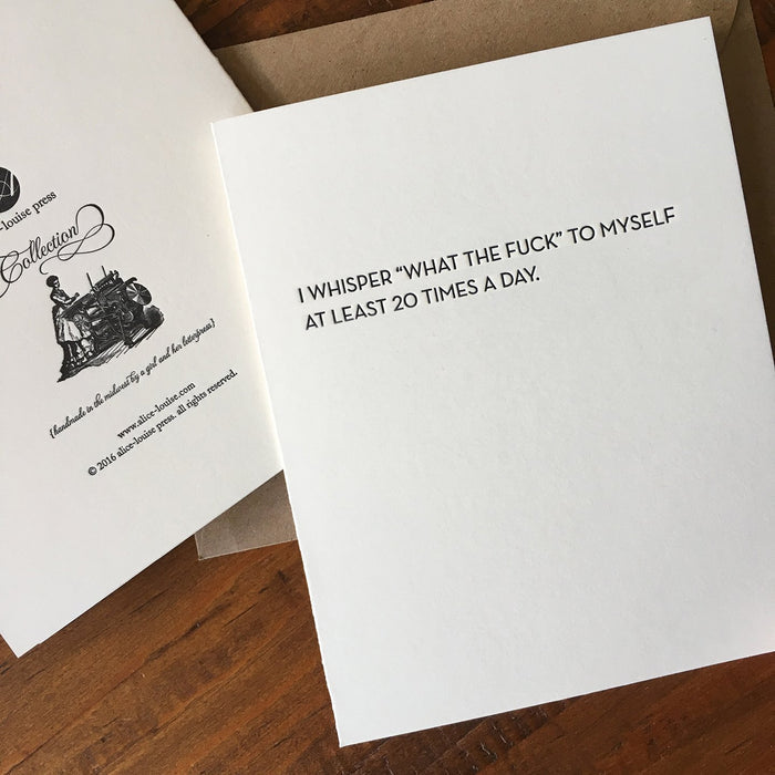 White quote card with black printed text: I WHISPER WHAT THE FUCK TO MYSELF