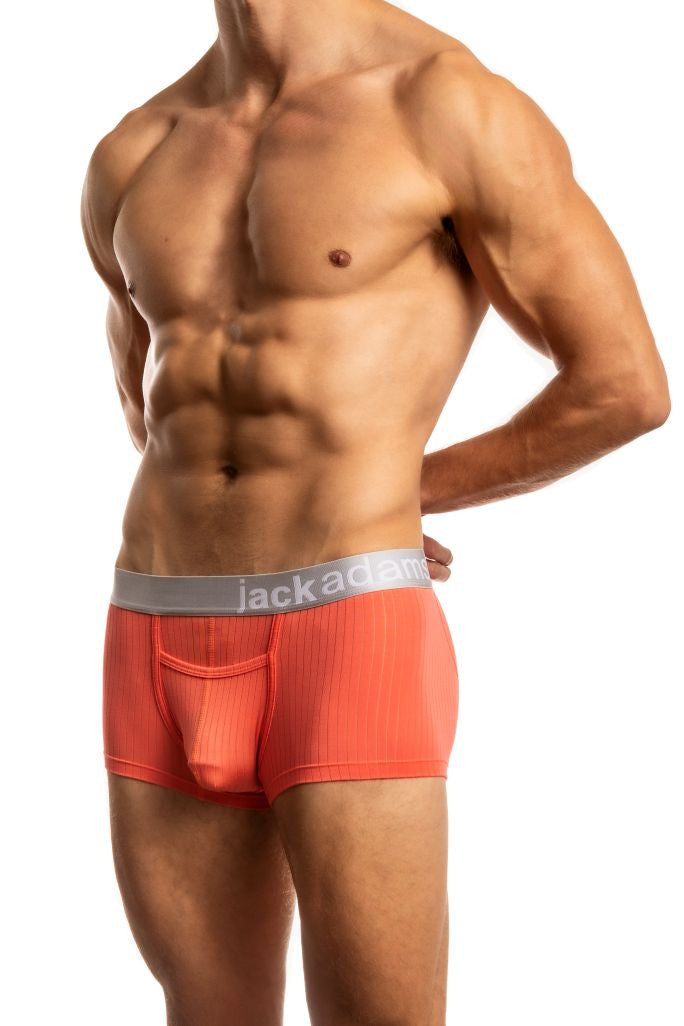 Shirtless man standing in front of a white background wearing a pair of Jack Adams Air Army Wide Ribbed Trunks in dubarry (profile view)