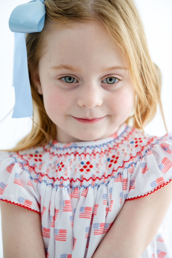 Girls Patriotic Smocked Dress – All-Over American Flag Print with Hand-Smocked Neckline – Fourth of July & Memorial Day – Sizes 12M–8