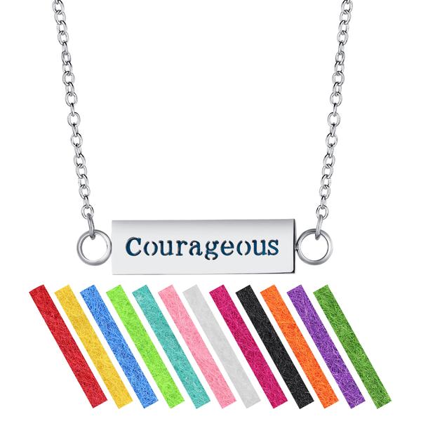 A stainless steel necklace diffuser pendant with the word 'COURAGEOUS' written in bold letters, attached to a 24-inch chain. The pendant comes with a series of colorful, striped refill pads.