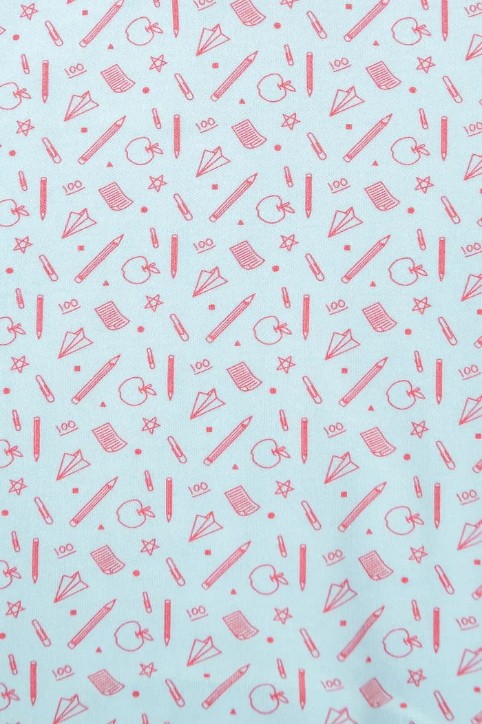 Close up of blue and red back to school pima cotton fabric.