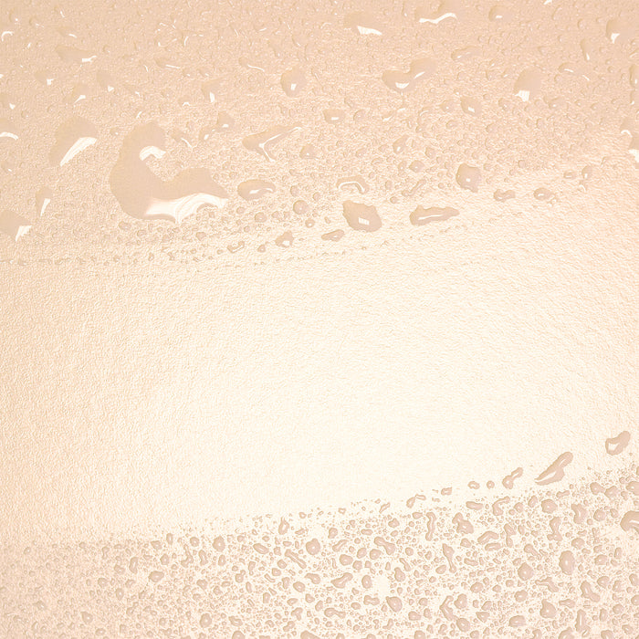 Close-up of lightweight, dewy skincare texture with water droplets, showcasing hydration and smooth finish for all skin types.