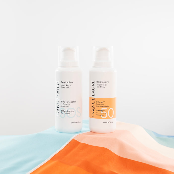 France Laure Révolusolaire face & body duo: SOS after-sun tan prolonger and Intense 50 environmental protection lotion on colorful towel