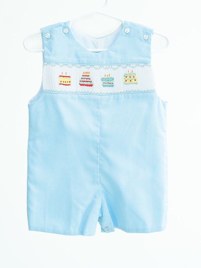 Birthday Boy Benjamin Jonjon is a charming Jon Jon featuring birthday cake designs on a super soft and comfortable polyester/cotton blend. Your birthday boy will steal the show in this Light Blue Birthday Cake Jon Jon, it comes in sizes for toddlers 12M to 4T.