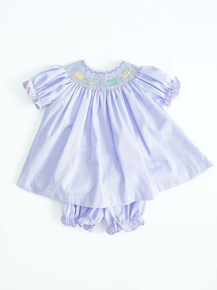 Birthday Girl Annabelle Bloomer Set is an adorable set featuring birthday cake designs on a super soft and comfortable polyester/cotton blend. Perfect for celebrating her special day, this charming ensemble adds a touch of sweetness to her birthday festivities, it comes in sizes for toddlers 12M to 6.