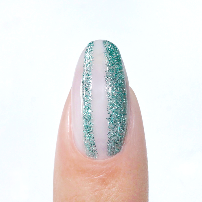 Bluminescence liner used for a teal glitter vertical stripe on a sheer nude nail