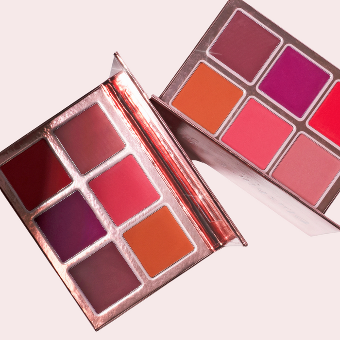 Pink Lipps Blushing’ On You Blush Palette open showing six rich hues: baby pink, rose coral, rich russet, red berry, deep bright purple, deep mauve – clean vegan formula.