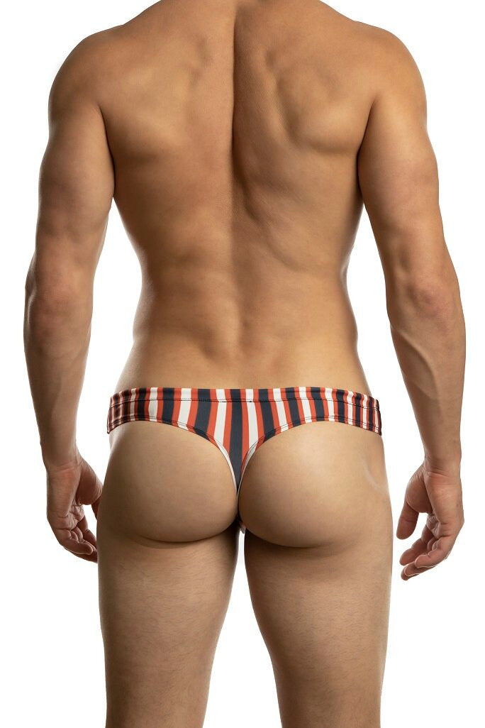 Man standing wearing a pair of Jack Adams navy/red Bondi Swim Thong (back view) on a white background.