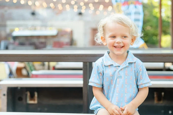 Boy wearing Cowboy Boots Harold Romper.