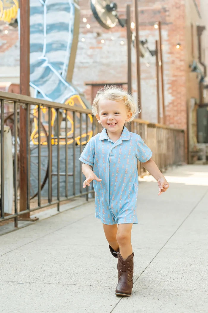 Boy wearing Cowboy Boots Harold Romper.
