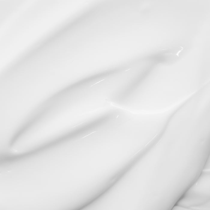 Smooth, luxurious white cream texture swatch for all skin types, showcasing rich hydration and elegant cosmetic formulation.