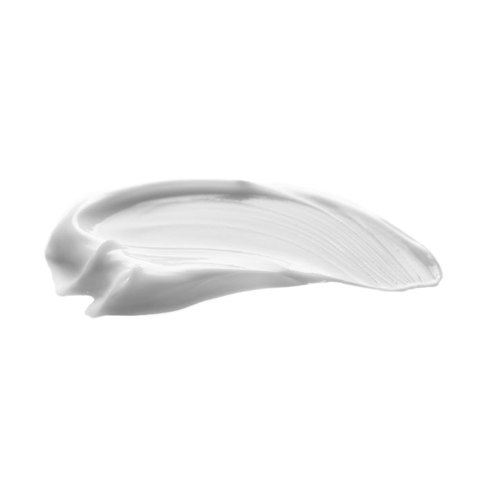 Smooth white cream swatch with silky texture, ideal for all skin types and ages, showcasing luxurious skincare formula