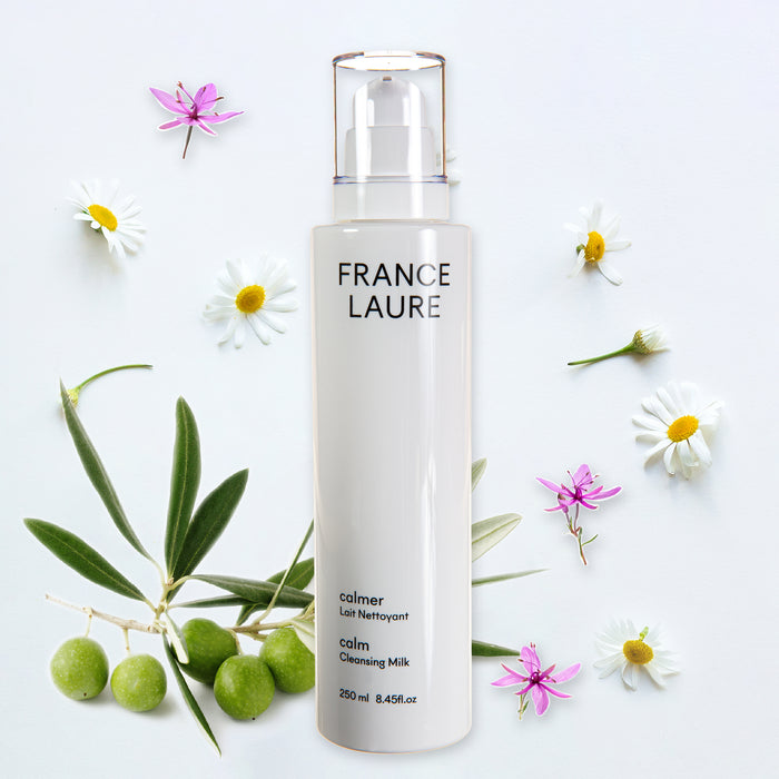 France Laure Calm Cleansing Milk bottle with olive branch and chamomile flowers, gentle skincare for sensitive skin