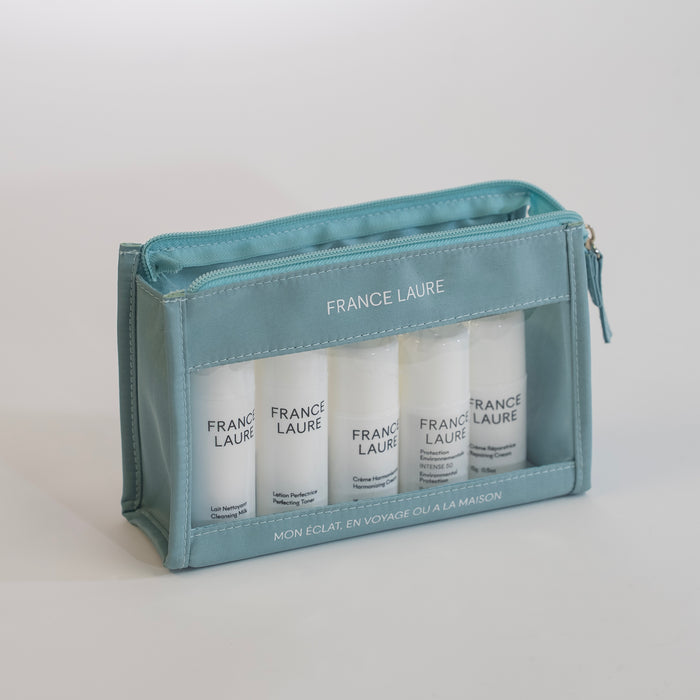 France Laure travel skincare set with cleansing milk, toner, harmonizing cream, SPF 50, and repairing cream in a mint zip pouch