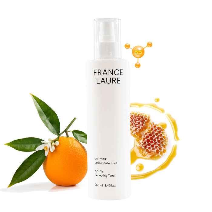 France Laure Calm Perfecting Toner with B5, shown with orange, honeycomb, and flower for soothing skincare