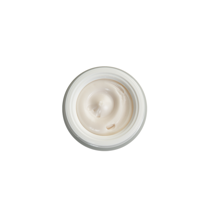 Luxurious cream texture in open jar, showcasing smooth, rich skincare formula for all skin types and ages