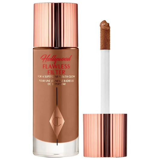 Charlotte Tilbury Hollywood Flawless Filter in Deep NIB, a beauty product with a sleek bottle and applicator for radiant skin.