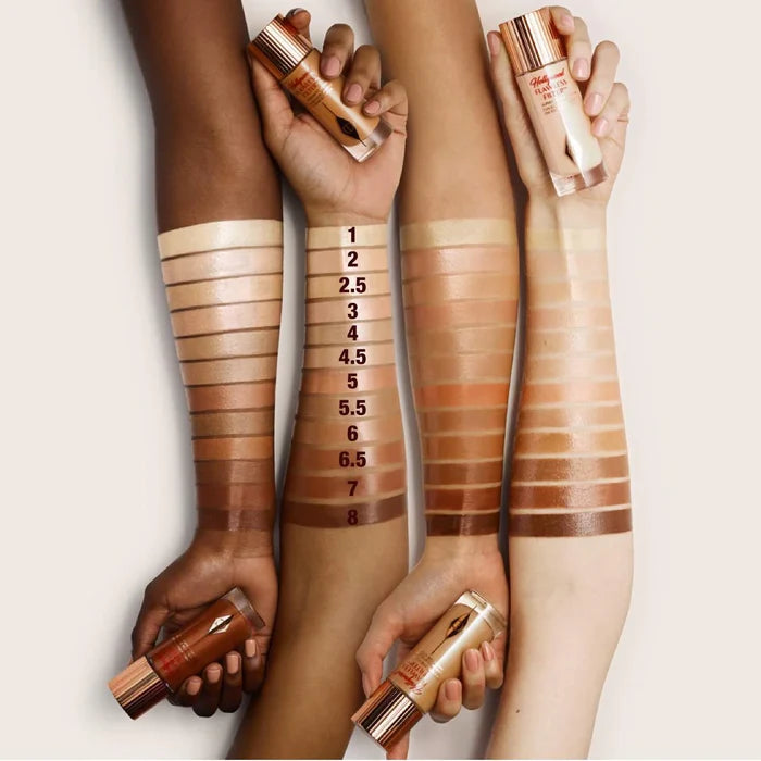 Charlotte Tilbury Hollywood Flawless Filter in Deep NIB, a beauty product with a sleek bottle and applicator brush visible in the image.