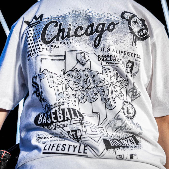 Youth model wearing white youth graphic tee with "Chicago White Sox Drip" design