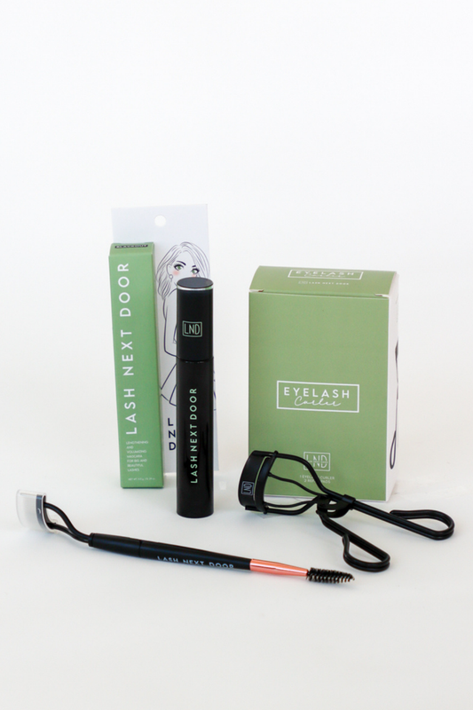 Eyelash extension kit with tools and packaging on a white background