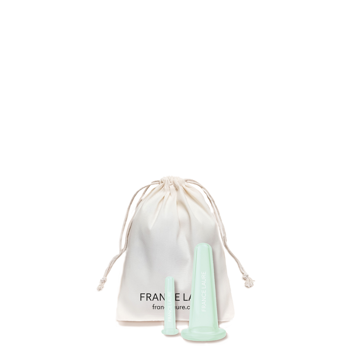 Mint green France Laure facial massage tools with branded cotton pouch, designed for skincare routines and facial contouring.