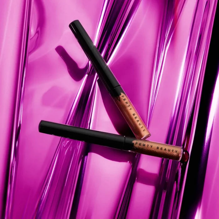 Fenty Beauty Glitty Lid shimmer liquid eyeliner in two shades, featuring a sparkling, glossy finish for eye makeup looks.