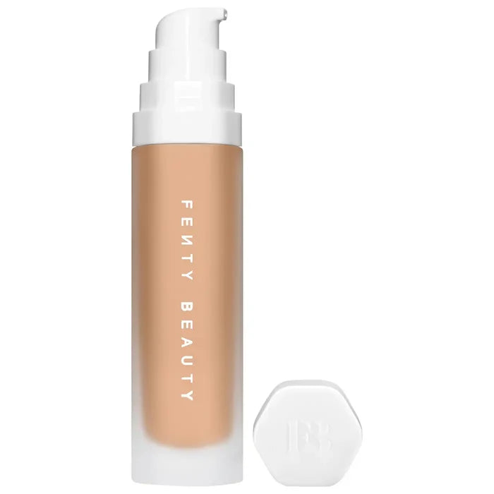 Fenty Beauty Soft’Lit Hydrating Longwear Foundation in various shades, featuring a luminous, natural finish on a beauty product display.