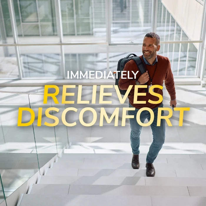 Flat Feet Support Insoles for Men by DrScholls helping relieve foot discomfort as a man climbs stairs in a bright modern building