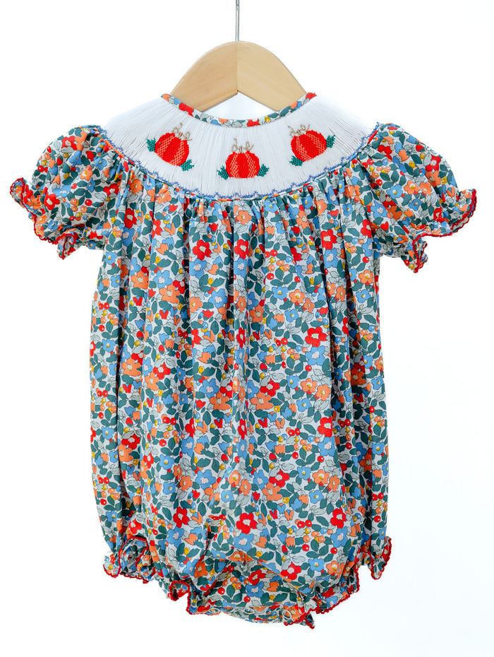 Smocked Floral Pumpkin Bubble by Ruth and Ralph, blue floral print with peter pan collar and smocked pumpkin embroidery, on hanger