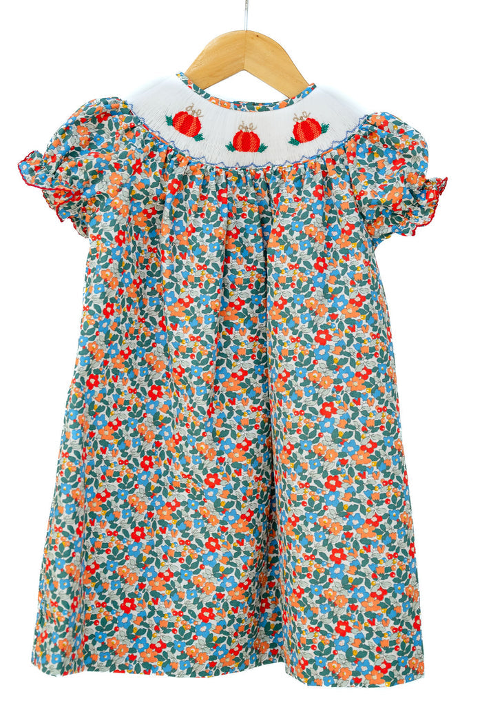 Smocked Floral Pumpkin Dress by Ruth and Ralph, blue floral print with bishop collar, on hanger