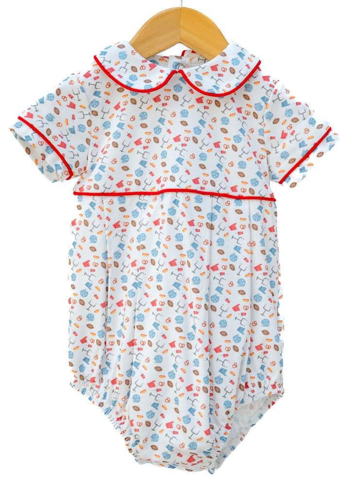 Pima Football Bubble in white with game day motif print, red piping, and rounded collar, one-piece snap closure