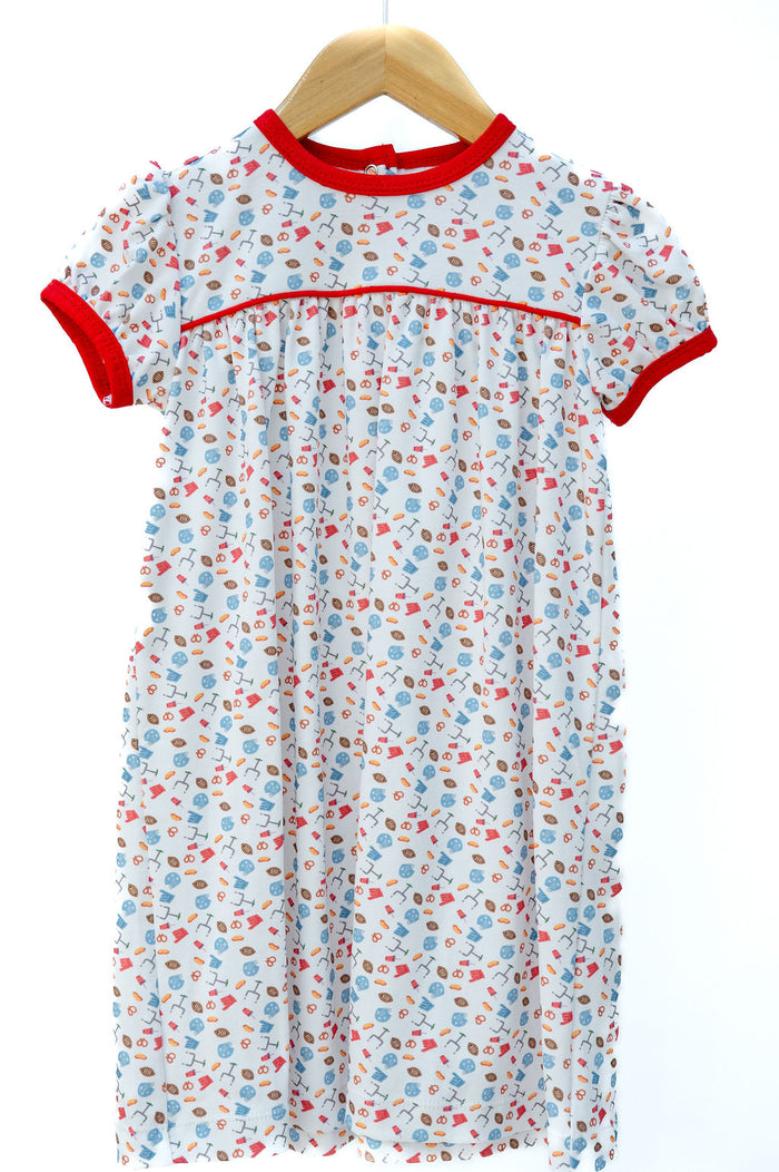 Pima Football Dress for girls in white with game day motif print, red trim, and piping, twirl-ready silhouette