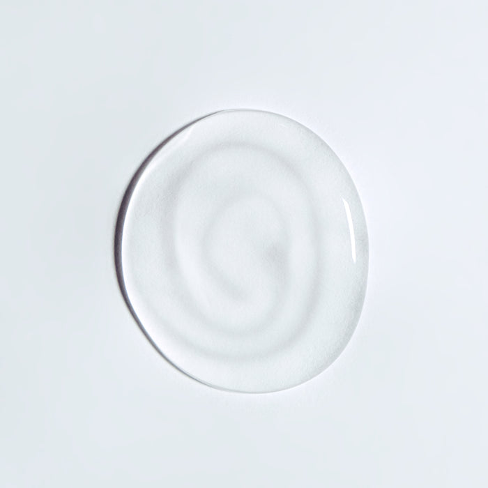 Clear hydrating serum drop with smooth texture on white background, showcasing lightweight skincare formula for all skin types.