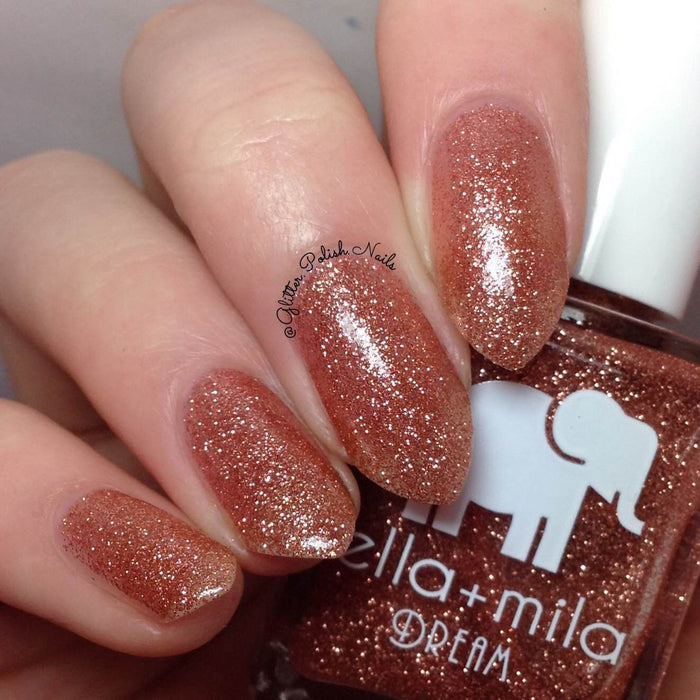 Glow With Me bronze and gold glitter nail polish close-up with the bottle