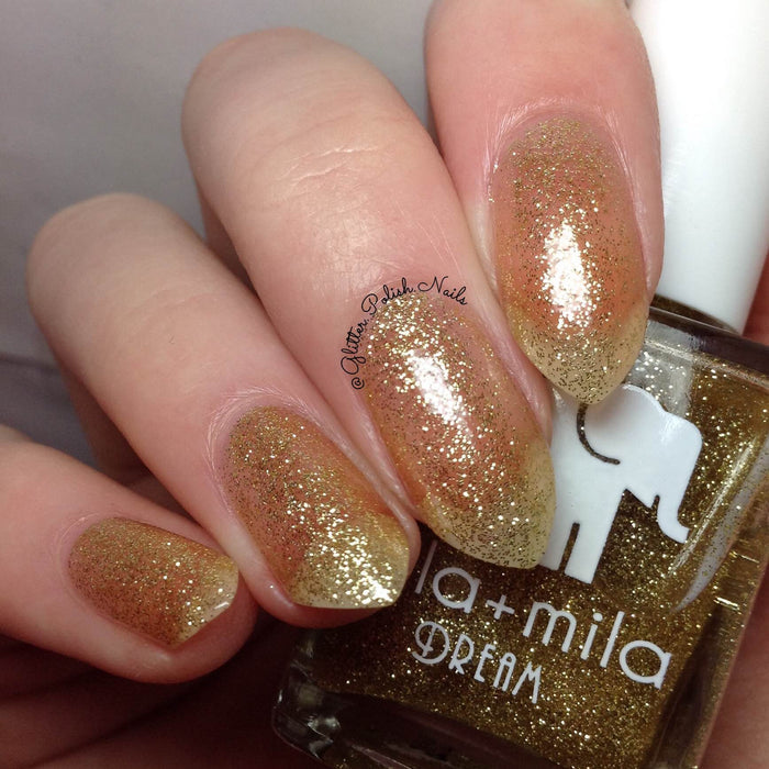 Golden Fairy gold glitter nail polish close-up with the bottle