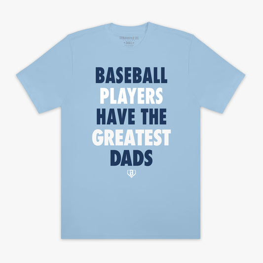 Light blue t-shirt with text 'BASEBALL PLAYERS HAVE THE GREATEST DADS' on a white background