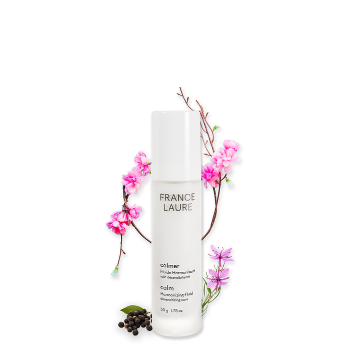 France Laure Calm Harmonizing Fluid for sensitive skin, 50g bottle with pink blossoms and botanical accents, soothing skincare solution