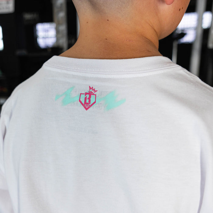 Youth model wearing white graphic tee with "Hit Tanks" design
