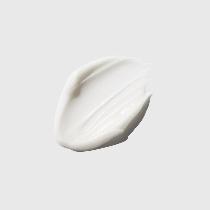 Smooth white cream swatch showcasing rich texture for all skin types, ideal for daily skincare and cosmetic routines.