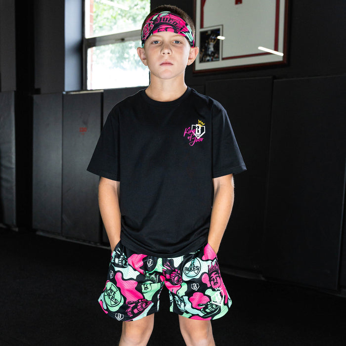 Youth model wearing black graphic tee with "King Of JUCO" design
