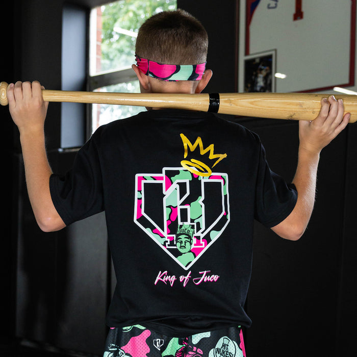 Youth model wearing black graphic tee with "King Of JUCO" design