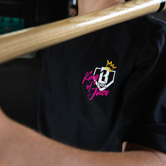 Youth model wearing black graphic tee with "King Of JUCO" design