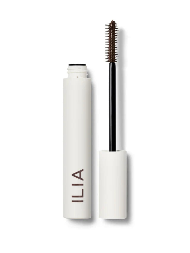 A tube of ILIA Limitless Lash mascara in "Before Dawn" (rich brown) with the wand applicator displayed next to it on a white background